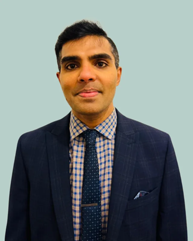 Raghu Chandar Mamindla, Pharmacist Independent Prescriber at Belgrave PharmHealth, wearing a navy suit.